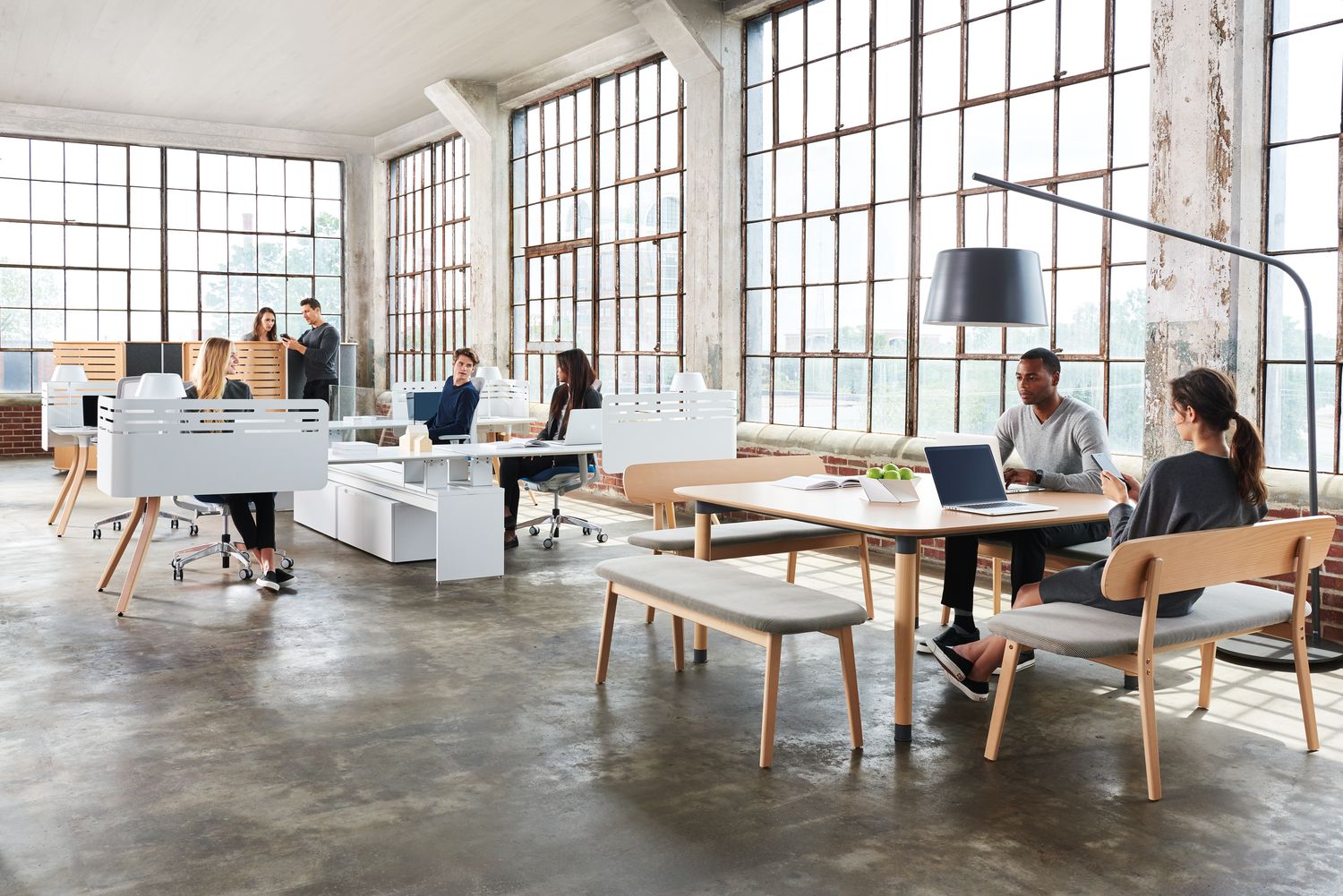 Coworkers enjoy their highly designed office workspace together.